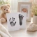 Stemningsbillede af baby hånd og fod aftrykssæt med hånd- og fodaftryk, bamse, babyfoto og babysko som et personligt minde om den første tid.