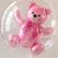 Close-up af transparent ballon med lyserød latex ballonbamse indeni til pige babyshower, barnedåb og fejring af en nyfødt pige.