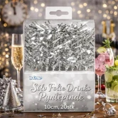 Sølv folie drinks pyntepinde 10 cm pakke med 20 stk vist i festligt cocktailmiljø med nytårsdekoration