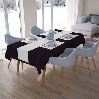 Elegant pyntet festbord med sort Sovie Airlaid papirdug og hvid bordløber, dækket med service i moderne festlokale.