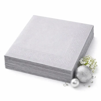 Sølvfarvede Sovie Tissue servietter i blødt papir, 20 stk, med diskret præget kant til elegant borddækning.